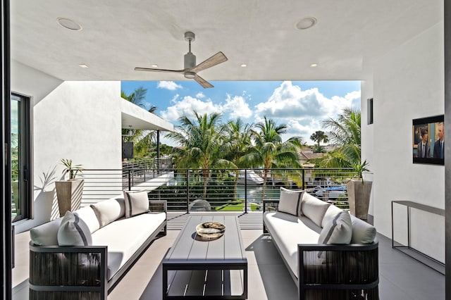 view of patio featuring outdoor lounge area, a water view, and ceiling fan