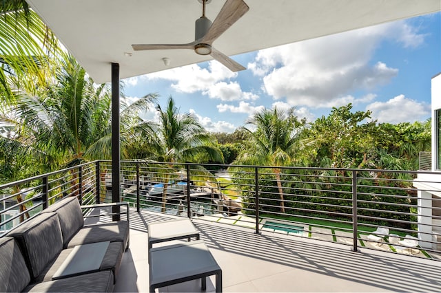 balcony featuring ceiling fan and an outdoor living space