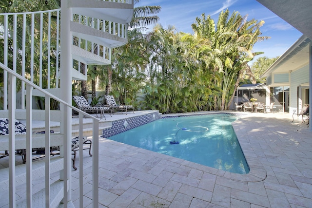 view of pool featuring a patio