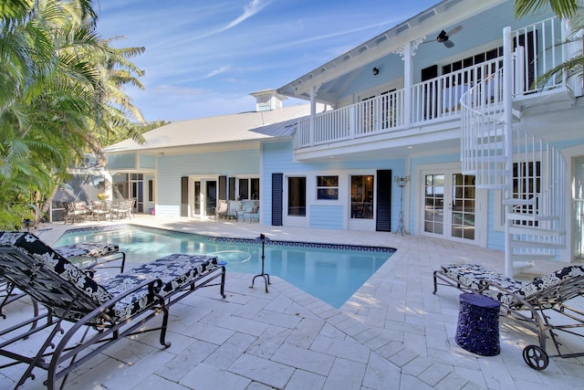 view of pool featuring a patio area and french doors