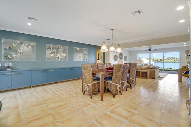 dining space featuring ceiling fan, ornamental molding, a water view, and light tile patterned flooring