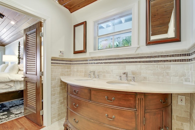 bathroom featuring vanity, tile walls, and wooden ceiling