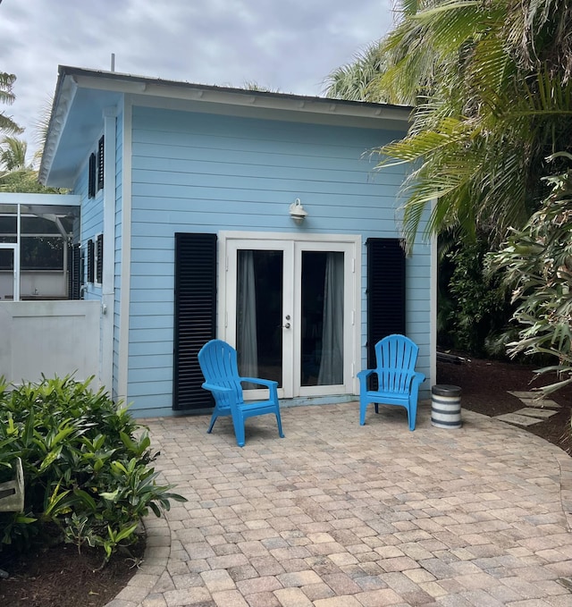 back of property with french doors and a patio