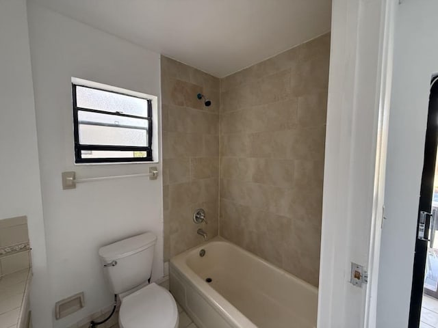 full bath featuring toilet and shower / washtub combination