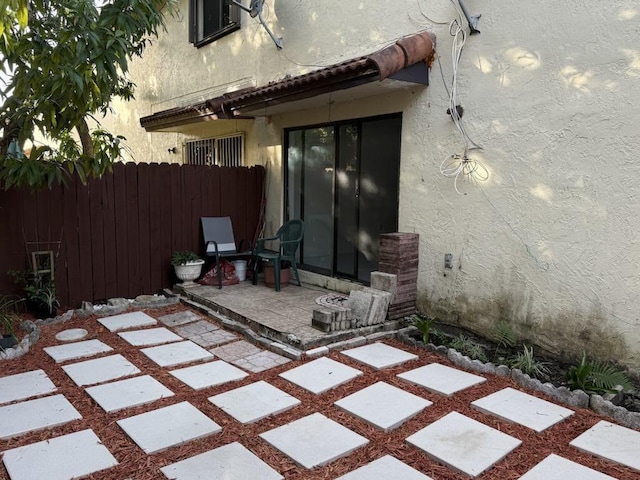 view of patio / terrace featuring fence