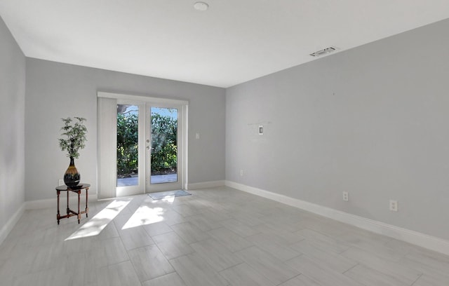 empty room featuring french doors