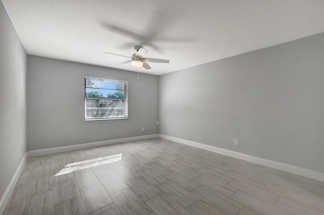 spare room with ceiling fan