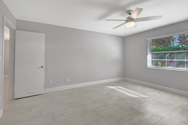 unfurnished room featuring ceiling fan