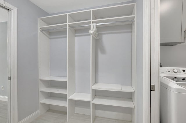 spacious closet featuring washer / dryer