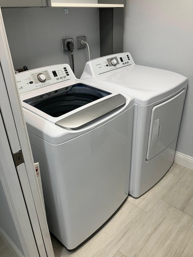 washroom with washing machine and dryer