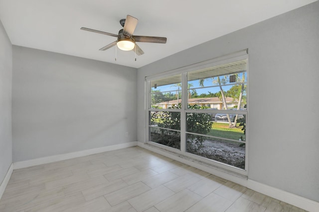 spare room with ceiling fan