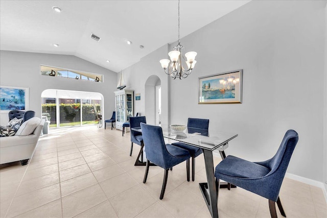 dining room with high vaulted ceiling, an inviting chandelier, and light tile patterned flooring