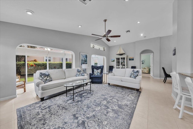 living room featuring ceiling fan, light tile patterned floors, and high vaulted ceiling