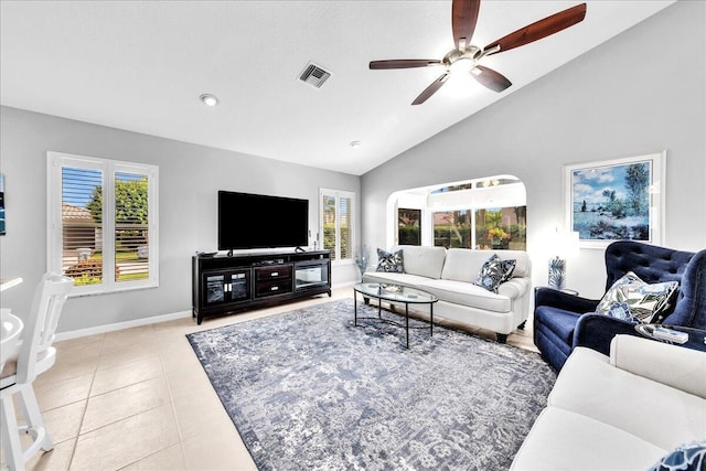 tiled living room with high vaulted ceiling and ceiling fan