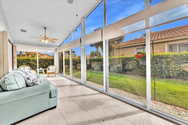 sunroom / solarium with a wealth of natural light, vaulted ceiling, and ceiling fan