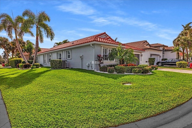 view of front of home featuring a front yard and a garage