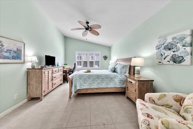 tiled bedroom with ceiling fan and vaulted ceiling