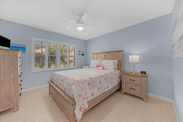 bedroom with ceiling fan and light tile patterned flooring