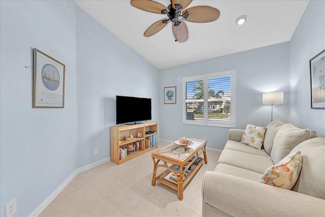 living room featuring ceiling fan and vaulted ceiling