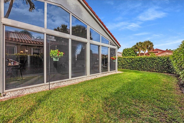 view of yard with a sunroom