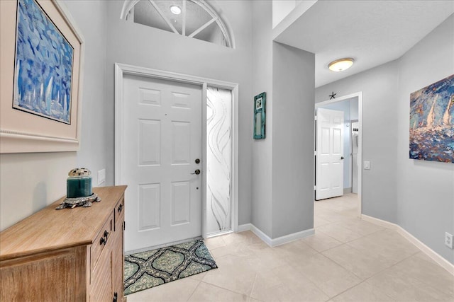 foyer with light tile patterned floors