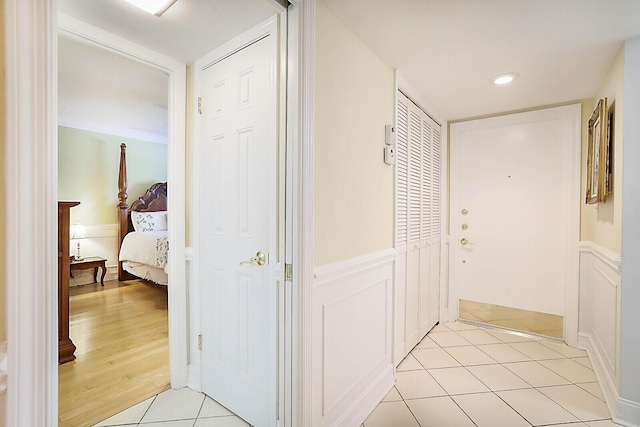 hallway featuring light tile patterned floors