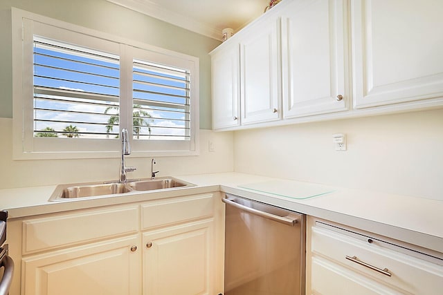 kitchen with white cabinets, stainless steel dishwasher, ornamental molding, and sink