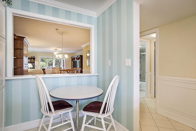 dining space with light tile patterned flooring, crown molding, and a chandelier