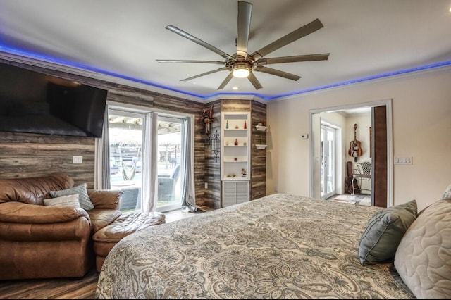 bedroom with ceiling fan, ornamental molding, and access to outside