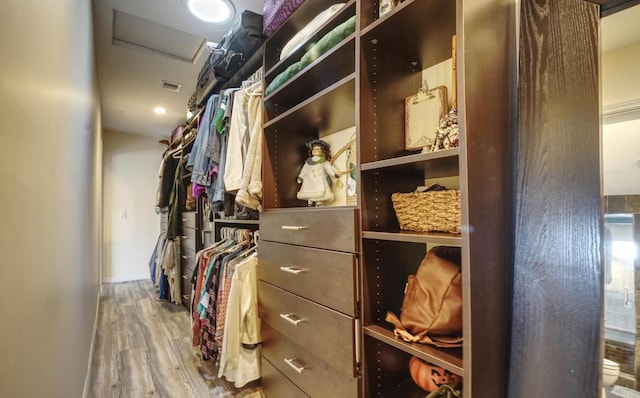 spacious closet featuring hardwood / wood-style flooring