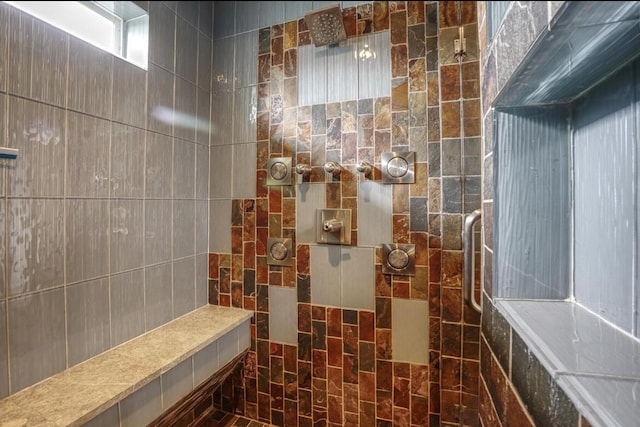 bathroom with a tile shower