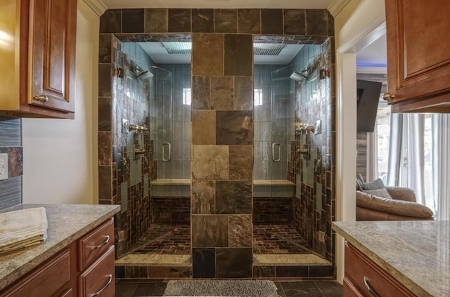 bathroom with vanity and an enclosed shower