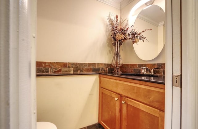 bathroom with vanity and crown molding