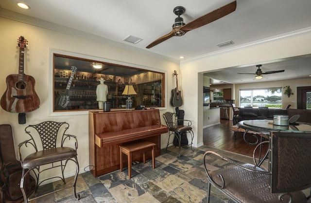 miscellaneous room with ceiling fan and crown molding