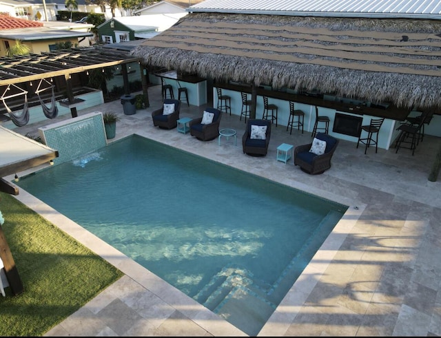 view of swimming pool featuring a gazebo, a patio area, and a bar