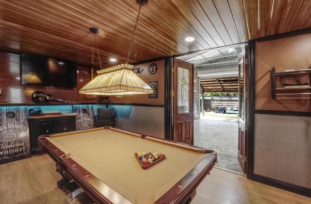 game room featuring light hardwood / wood-style flooring, wooden ceiling, and billiards