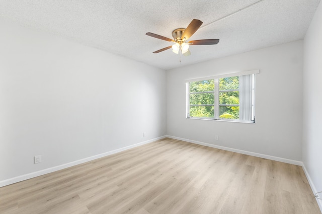 unfurnished room featuring a textured ceiling, light hardwood / wood-style floors, and ceiling fan