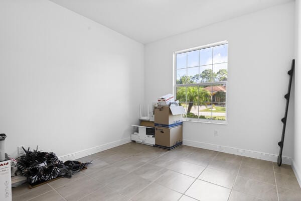 view of tiled spare room