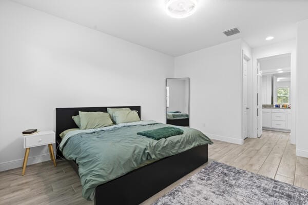 bedroom featuring ensuite bathroom