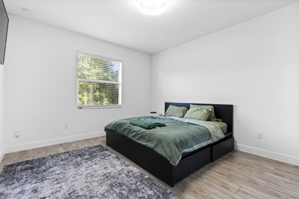 bedroom featuring light wood-type flooring