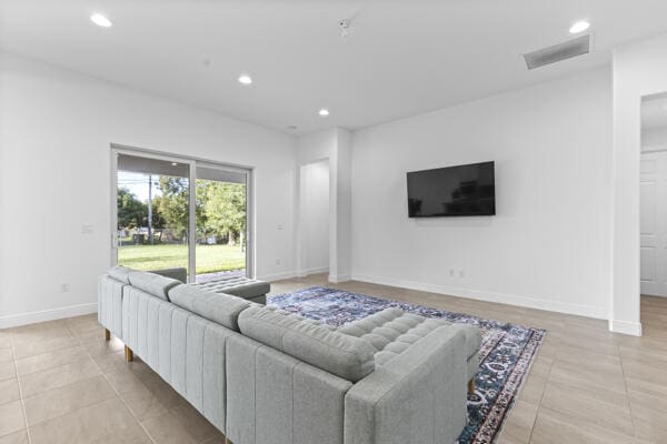 living room with light tile patterned floors