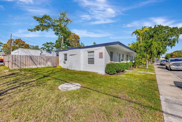 view of property exterior with a yard