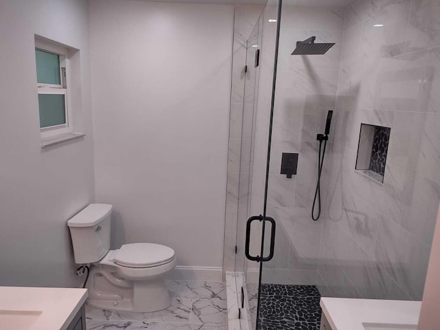 bathroom with vanity, toilet, and an enclosed shower