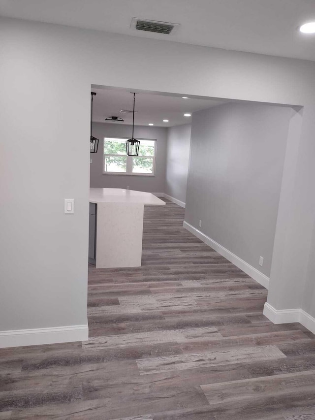 corridor with dark wood-type flooring