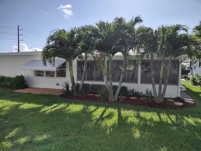 view of home's exterior featuring a lawn