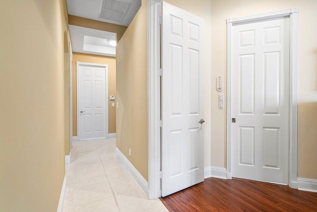 corridor with light hardwood / wood-style flooring