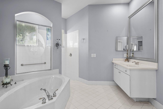 bathroom with separate shower and tub, tile patterned floors, and vanity