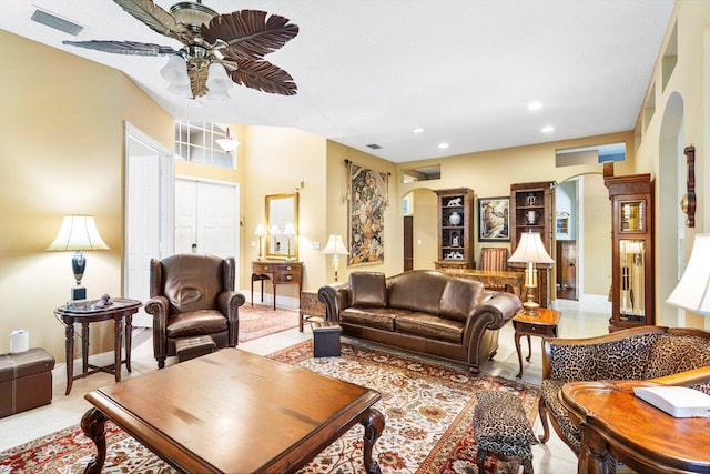 living room with ceiling fan and light tile patterned floors