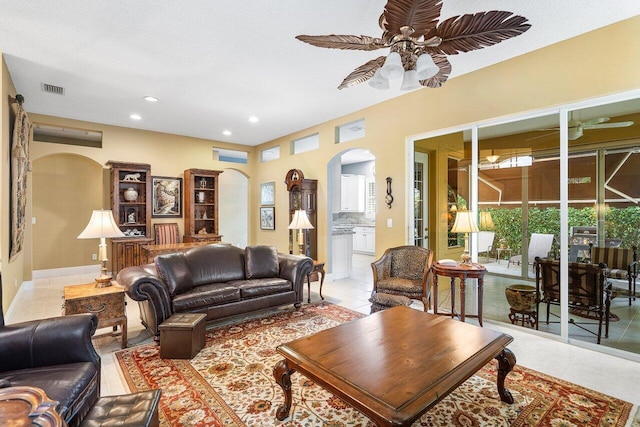 living room featuring ceiling fan and light tile patterned floors