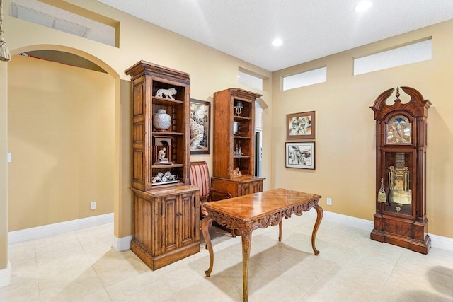 office area with a textured ceiling